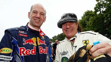 Adrian Newey, Red Bull Racing Chief Technical Officer shakes hands with Brian Johnson of the band AC / DC during day one of The Goodwood Festival of Speed at The Goodwood Estate on July 2, 2010 in Chichester, England.