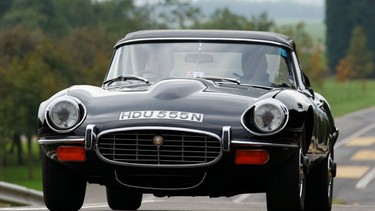 A 1974 Jaguar E-Type Series 3 takes part in Jaguar's 75th anniversary celebrations.