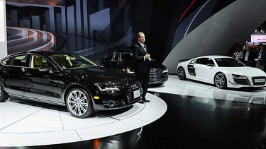Audi of North America President Johan de Nysschen stands in between the new Audi A7 and A8L and R8GT during a news conference at the two-day media preview event for the 2010 Los Angeles Auto Show on November 18, 2010 in Los Angeles, California.