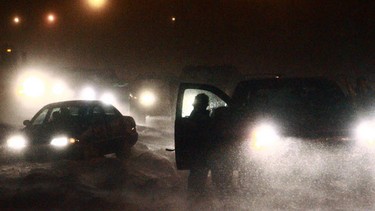 A car gets stuck in deep snow in Calgary in this file photo.