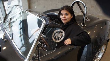 Chloe Brown sits in the 500-horsepower Cobra built at Vancouver Community College in the NASKARZ (Never Again Steal Cars) program.