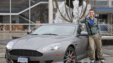 BC Ballet dancer Connor Gnam with a 2010 Aston Martin DB9 at the Queen Elizabeth theatre in Vancouver, BC.
