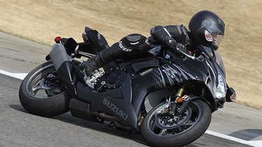 David Booth riding a 2011 Suzuki GSX- R750 at Barber Motorsports race track.