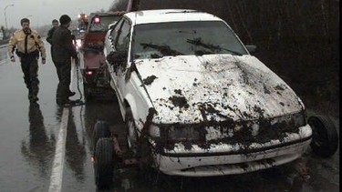 A Vancouver driver lost control in the rain and went off the road, rolling over in the ditch in this file photo. Police on the scene said bald tires on the car contributed to the accident.