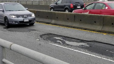 Potholes such as these are slowly being repaired by municipalities after a long winter but many still exist and have the potential to damage your car.