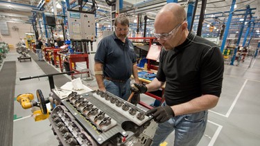 David Booth builds a Chevrolet Corvette LS9 engine with the assistance of General Motors Engine Builder Bruce Blomfield at the GM Performance Build Center in Wixom, Michigan.