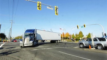 A transport truck turns onto a busy intersection in this file photo.