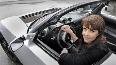 Stargate actress Amanda Tapping tests out a 2011 Tesla Roadster for Big Wheels.