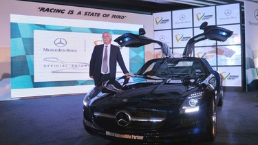 Managing director and chief executive officer of Mercedes-Benz India Peter Honegg poses with an SLS AMG safety car for Formula One racing event at a press conference in New Delhi on August 24, 2011. Mercedes-Benz and JPSI sports, have struck an accord that Mercedes-Benz cars will be used as safety-monitor cars for all events at the tracks of the inaugural Indian Formula One Grand Prix at Buddh International Circuit.