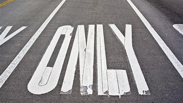 Various lines and road markings outline where and how a motorist should drive. Solid, dotted and staggered lines. Crosswalk, train crossing and bus lane markings. School zone, upcoming speed bumps and turn lane arrows. Many motorists find fresh paint markings daunting.