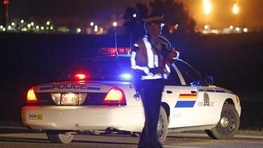 An RCMP officer stops traffic in this file photo.