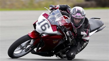 Stacey Nesbitt tackles a corner on her motorcycle.