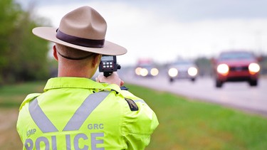 Const. Kevin Woytas trains a radar gun on vehicles along Alberta's Highway 63.