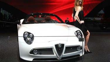 A model stands with an Alfa Romeo during the last Paris Motor Show in 2010.