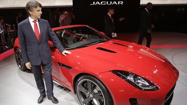 Dr. Ralf D. Speth, Chief Executive Officer of Jaguar LandRover Limited, poses next to a new Jaguar F-Type during the press day at the Paris Auto Show.
