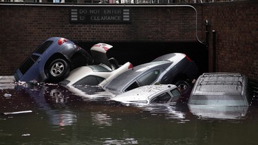Cars are submerged at the entrance to a parking garage in New York's Financial District in the aftermath of superstorm Sandy,