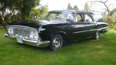 The black 1961 Dodge Dart Pioneer station wagon.