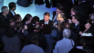 Alan Mulally, President and CEO, Ford Motor Company is surrounded by reporters and photographers, January 2010.
