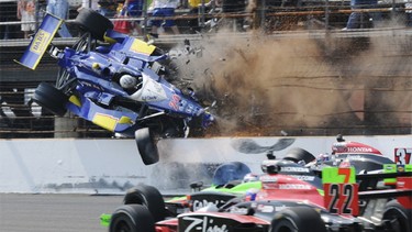 Dreyer & Reinbold Racing driver Mike Conway flies through the air after crashing with Andretti Autosport driver Ryan Hunter-Reay during the 94th running of the Indianapolis 500 auto race in Indianapolis, Indiana May 30, 2010.