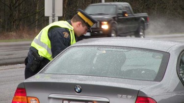 Police ticket cellphone talking drivers during a Feb. 16 blitz.