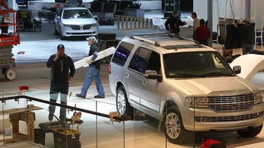 Technicians are working around the clock at the Cobo Center in Detroit, MI. to set up the 2012 North American International Auto Show. Workers in the Ford area were busy setting up their displays Thursday, Jan. 5, 2012.