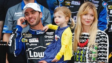 Jimmie Johnson, driver of the #48 Lowe’s Chevrolet, stands with his wife Chandra Janway and daughter Genevieve Marie in victory lane after winning the NASCAR Sprint Cup Series Daytona 500 at Daytona International Speedway on February 24, 2013 in Daytona Beach, Florida.