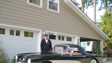 Doug Penn with his 1957 Corvette at the his B&B in Sechelt. The beautiful styling that characterized the vehicle is enhanced by the black paint with silver accents.