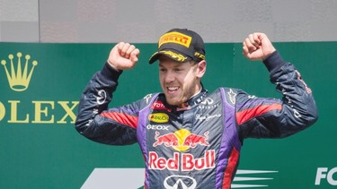 Red Bull F1 driver Sebastian Vettel of Germany celebrates after finishing first in the Formula One Canadian Grand Prix at the Circuit Gilles Villeneuve in Montreal on Sunday, June 9, 2013.