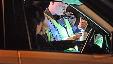 A Vancouver Police officer conducts a roadside check for impaired drivers in this file photo.