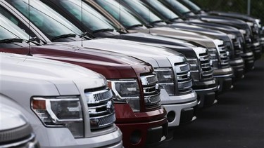 Ford F-150 pickups are seen on the sales lot.