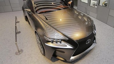 Lexus International Executive Vice President Mark Templin poses with a Lexus LF-CC concept car at a Lexus showroom in Tokyo Friday, Aug. 23, 2013. Toyota’s luxury brand Lexus is trying to shake off its stodgy image. So it’s opening a cafe. The special lounges, the first of which is opening next week in Tokyo’s fashionable Aoyama district, are designed to look more like a chic home than a standard showroom. In fact, only one vehicle can be displayed at a time. (AP Photo/Itsuo Inouye)