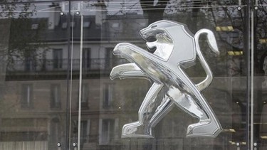 The Peugeot Citroen headquarters' sign is pictured in Paris, April 29, 2013. THE CANADIAN PRESS/AP, Michel Euler