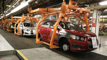 In this April 25, 2012 photo, Chevrolet Sonics move down the line in Orion Township, Mich. THE CANADIAN PRESS/AP, Duane Burleson