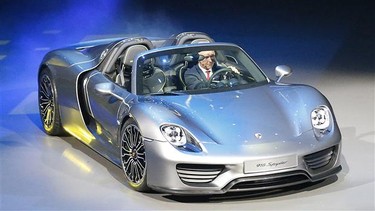 Porsche AG CEO Matthias Mueller steers the new Porsche 918 Spyder during a preview by the Volkswagen Group prior to the 65th Frankfurt Auto Show in Frankfurt, Germany.