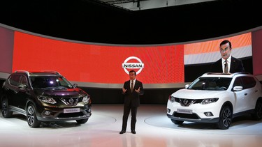 Nissan CEO Carlos Ghosn presents the new Nissan X-Trail during the first press day of the 65th Frankfurt Auto Show in Frankfurt.