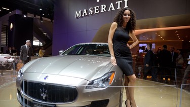 A model stands beside the Maserati Quattroporte Ermenegildo Zegna at the 2013 Frankfurt Motor Show.