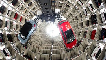 A New Beetle Cabrio, left, and a Golf VII are seen in the elevators of the storage of Volkswagen in Wolfsburg, northern Germany.