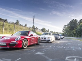 Cars drive the Nurburgring course, which is one of the most difficult in the world.