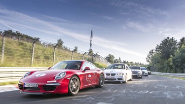 Cars drive the Nurburgring course, which is one of the most difficult in the world.