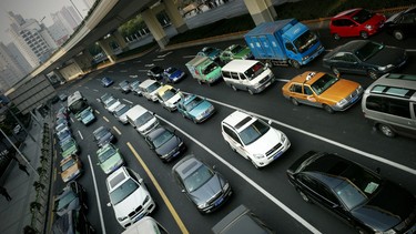 Cars wait at a stoplight in Shanghai, China.