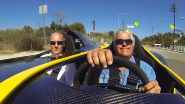 Jay Leno drives the ultra exclusive Aston Martin CC100 concept, and the look on his face says it all.