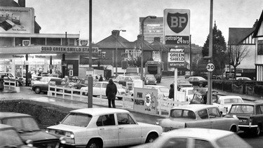 Cars wait in line at a petrol station in London, England, during the height of the oil crisis, December 1973.
