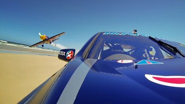 Red Bull Racing Australia driver Jamie Whincup takes on aerobatic pilot Joel Haski on the beautiful beaches of Australia's Gold Coast.