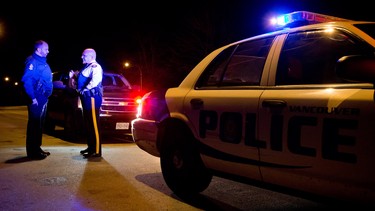 An RCMP Inspector talks with a Vancouver Police officer in this file photo.