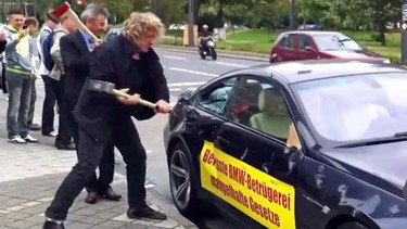 An angry BMW owner staged a dramatic protest by smashing up his M6 outside the Frankfurt Auto Show.