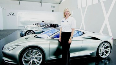 Wendy Durward stands with the three Infiniti concept cars during the Nissan 360 event at the El Toro jet fighter base in Southern California last week.