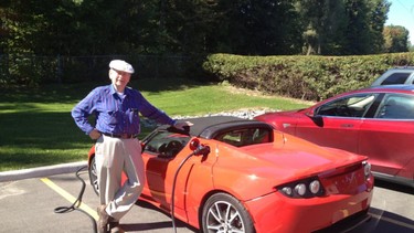 Alfred Cassidy with his son-in-law’s 2010 Tesla Roadster 2.0.