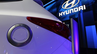 The charging plug is seen on a Hyundai Tucson Fuel Cell Hydrogen-Powered Electric Vehicle during media preview days at the 2013 Los Angeles Auto Show.