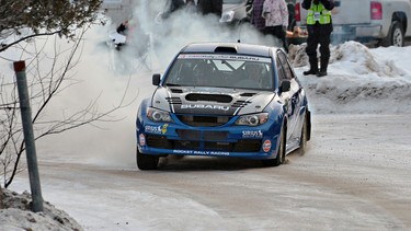 Patrick Richard, four-time Canadian Rally Champion and two-time overall North American Rally Champion, dashes through the snow in his rally-blue Subaru WRX STI.