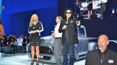 Cars, trucks and accessories aren't the only stars at the annual SEMA show. Here, Gene Simmons and Shannon Tweed do some huckstering at one of the presentations.